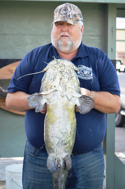 Man holding a large 35 pound catfish